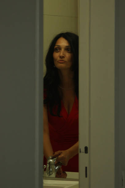 istock Beautiful woman face reflection in mirror 1025375166