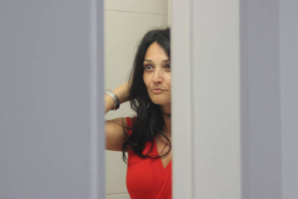 istock Beautiful woman face reflection in mirror 1025375288