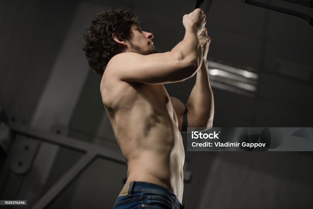 Strained Muscles Jpg Muscular Person Trains In Gym Performs Exercise On Hands Bare Torso ...