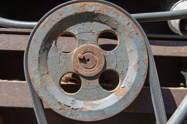old electric machine driven by a V-belt