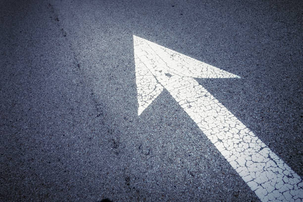 istock Close up elevated view of arrow sign on road 1025386148