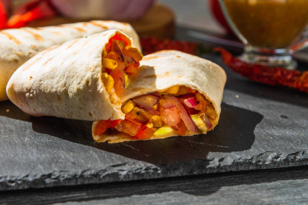 istock Traditional Mexican burrito on a serving board closeup 1025386214