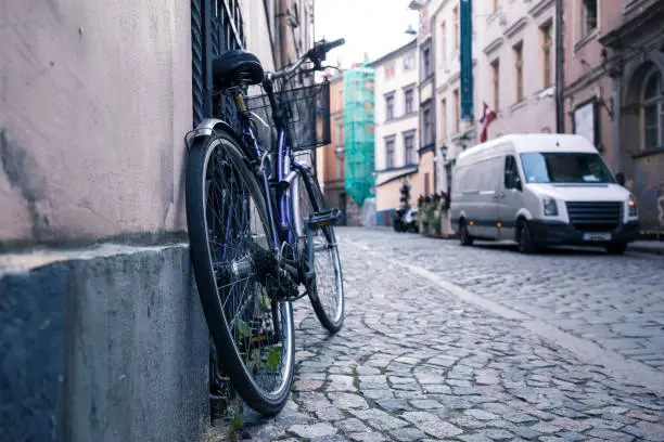 A bike in the old streets as a symbol of eco-friendly transport. Cobblestone pavement in the historic center of Riga, Latvia.