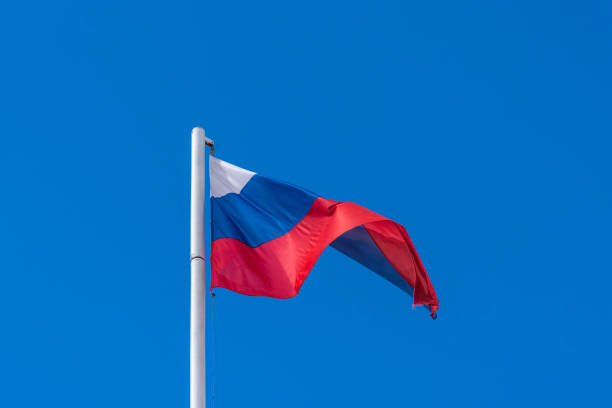 istock Evolving Russian flag on the background of blue sky 1025386996
