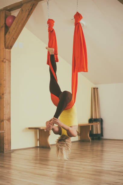 istock Woman doing aerial yoga 1025394934