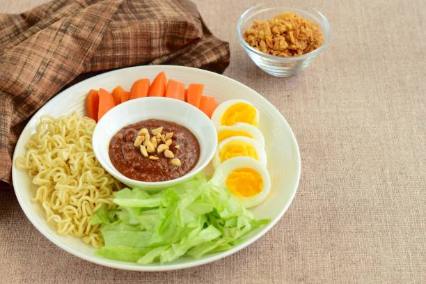 istock Noodle, lettuce, carrot, boiled egg and peanut sauce 1025402080