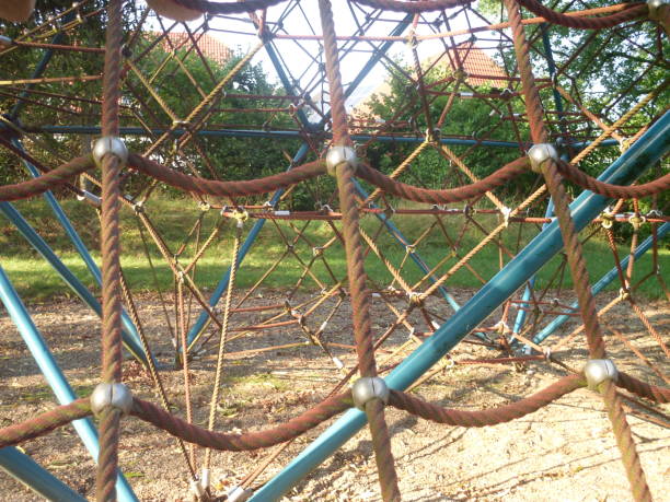 istock Landscape summer playground with climbing equipment and sandbox 1025402258