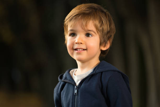 istock portrait outdoors smiling little boy 1025402724