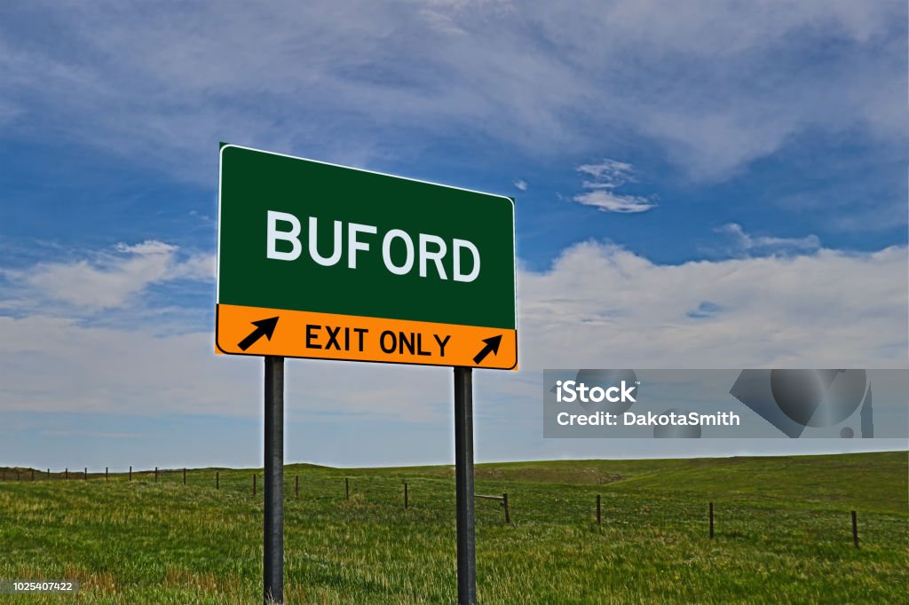 BUFORD US Highway Exit Only Sign Composite Image of an "EXIT ONLY" US Highway / Interstate / Motorway for the town / city of BUFORD Agricultural Field Stock Photo