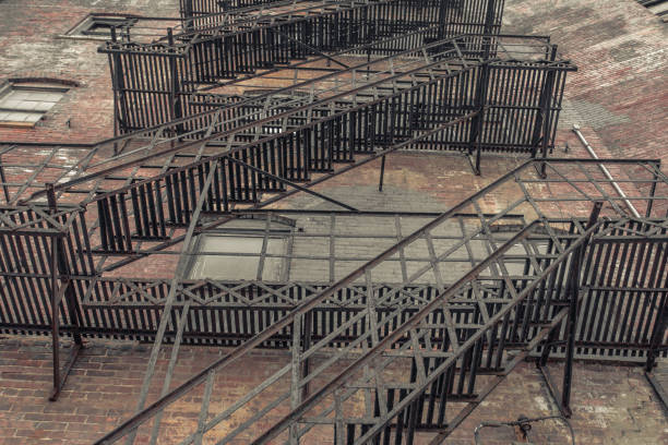 istock Looking up at metal fire escape 1025411554