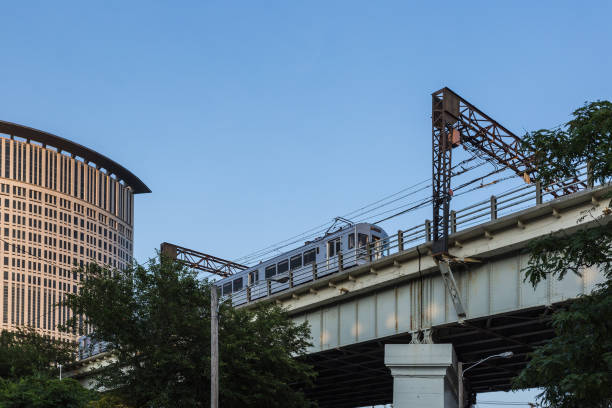 istock Train passing overhead in urban area 1025413760