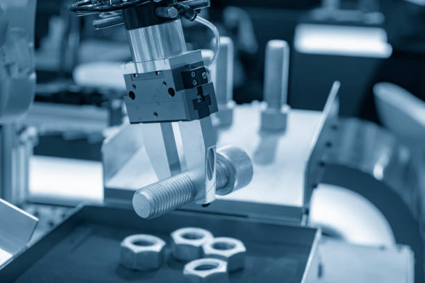 istock The robot arm catch the steel bolt for manufacturing   process . 1025414128