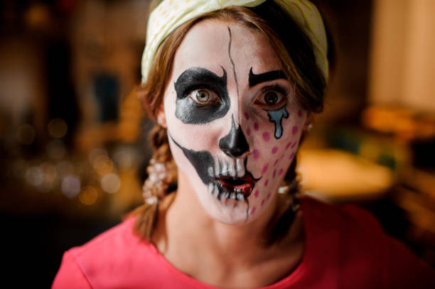 istock Pretty young redhead girl with adorable Halloween makeup 1025416892