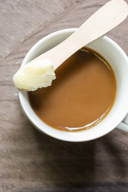 Coffee blended with butter tester good. Trend may forever change the way you drink coffee. Instead of the usual cream and sugar, on wooden background