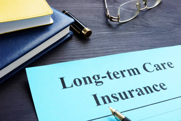 istock Long term Care Insurance policy on a table. 1025426098