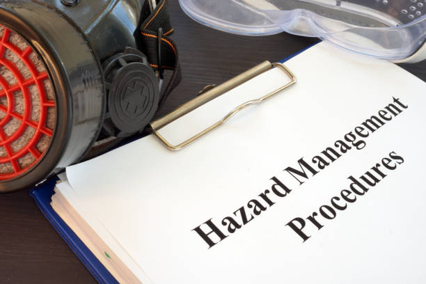 istock Clipboard with Hazard Management Procedures documents on the desk. 1025426402