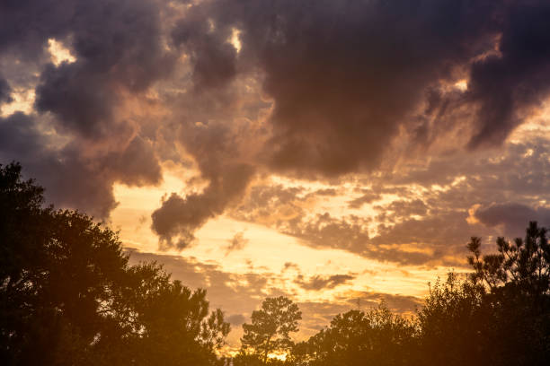 istock Sunset sky with clouds in vibrant hues. 1025426682