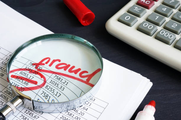 Financial or taxes fraud. Business report and magnifying glass. Financial or taxes fraud. Business report and magnifying glass. white collar crime stock pictures, royalty-free photos & images
