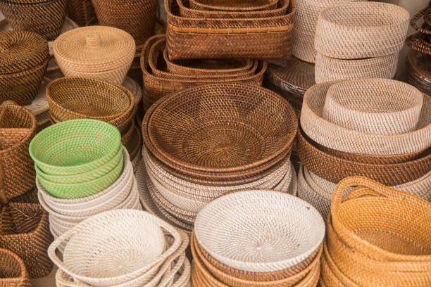 istock Hand made wicker, wooden or rattan tableware on display for sale 1025427252