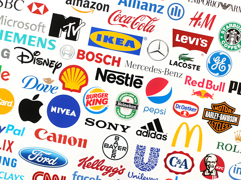 Logotype collection of some of most famous brands in the world on a screen - including Adidas, Nestle, Nike, McDonald's, Sony, Facebook, Ikea, Pepsi and much more printed on quality paper and shot with a high resolution camera.