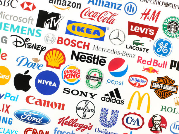 Brands Logotype collection of some of most famous brands in the world on a screen - including Adidas, Nestle, Nike, McDonald's, Sony, Facebook, Ikea, Pepsi and much more printed on quality paper and shot with a high resolution camera. brand name photos stock pictures, royalty-free photos & images