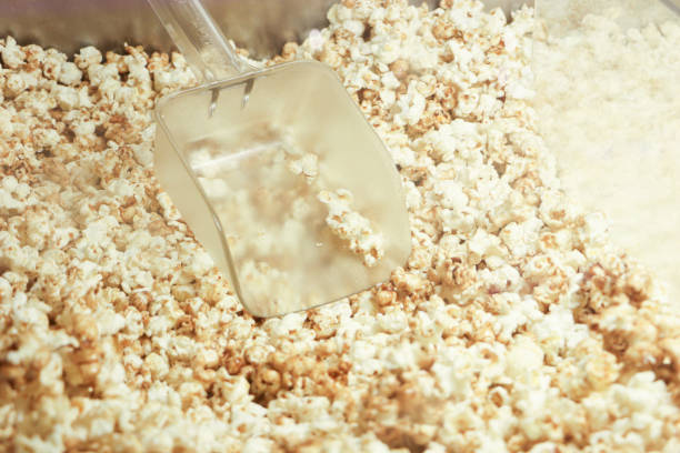Popcorn texture.Salted popcorn in plastic box ready for sell