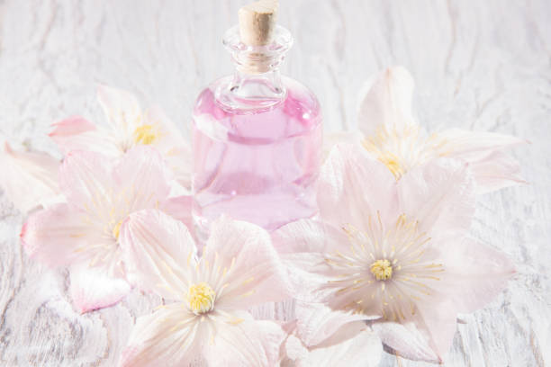 istock Perfume bottle and white flowers 1025438774
