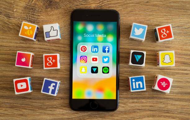 Social media cubes İstanbul, Turkey - August 25, 2018: Plastic cubes with popular social media services icons, including Facebook, Instagram, Youtube, Twitter and an Apple iPhone 8 smart phone on an desk. pinterest stock pictures, royalty-free photos & images