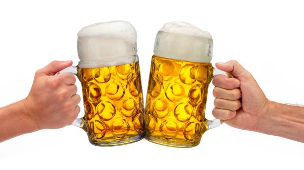 two isolated beer mugs in hand at Beer Fest in Munich stock photo
