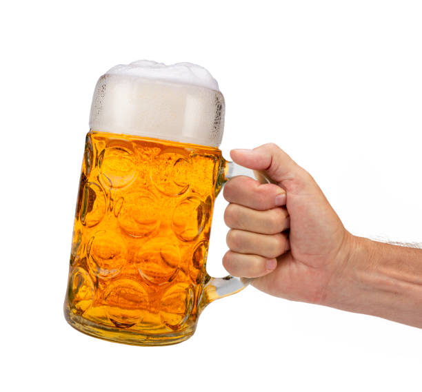 istock isolated beer mug in hand at Beer Fest in Munich 1025456600