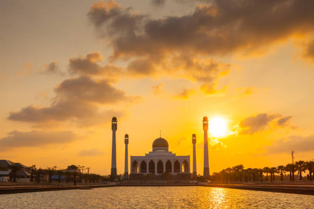 istock A silhouette of a mosque reflection on water at sunset 1025457094