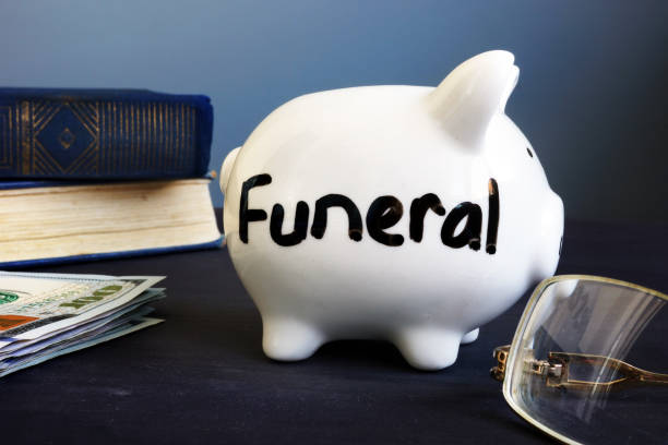 Funeral plan written on a side of piggy bank. Funeral plan written on a side of piggy bank. funeral planning stock pictures, royalty-free photos & images