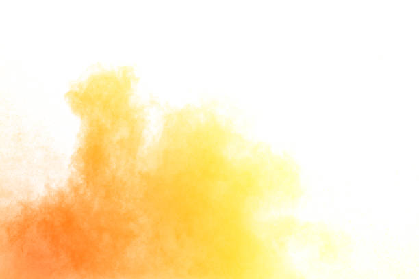 istock Abstract yellow-orange powder explosion white on  background. Yellow dust particle splashing. 1025471060