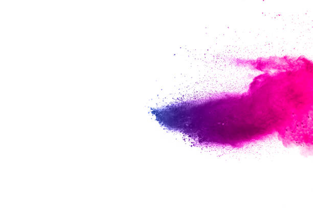 istock abstract explosion of blue-pink dust on white background. 1025471128