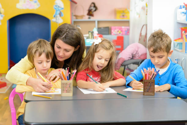istock Kids and Educator Playing at Kindergarten 1025471296