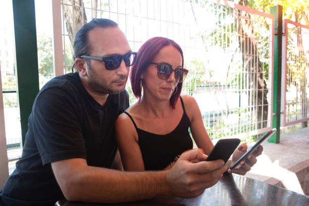 istock Happy couple looking at mobile phone. 1025476814