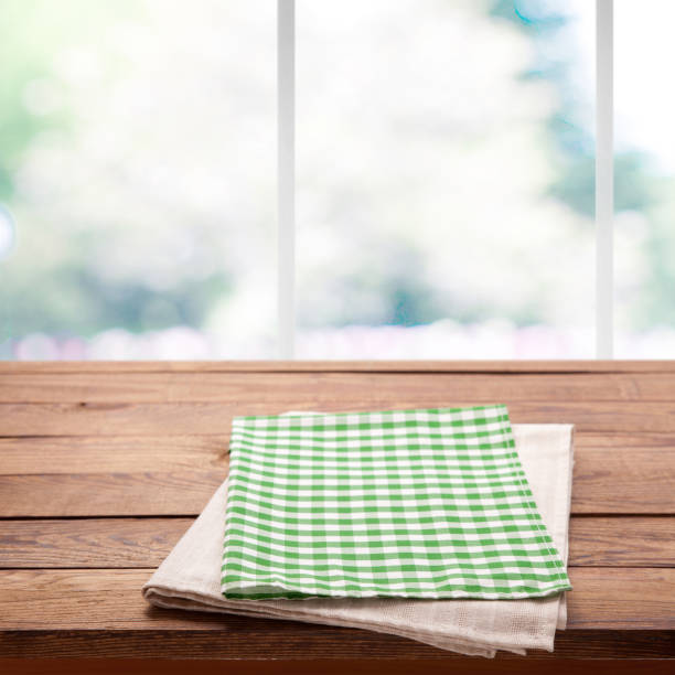 istock Tablecloth on wooden table on kitchen. Canvas, dish towels on kitchen top view mock up. Selective focus. 1025477524