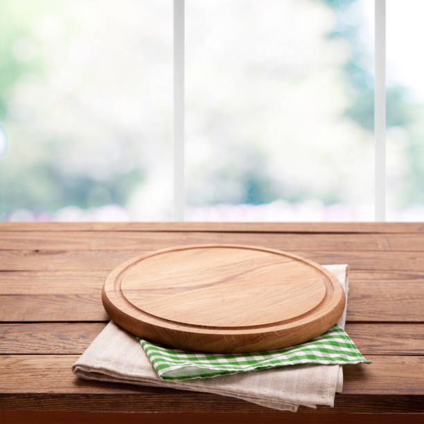 istock Board for pizza and tablecloth in kitchen. Canvas, dish towels on white background top view mock up. Selective focus. 1025477536