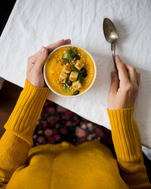 istock Serving roasted-pumpkin soup in a white bowl 1025484378