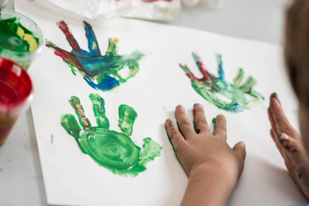 istock Toddler child hand painting 1025490480