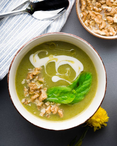 Broccoli cream soup in a bowl. Top view. stock photo
