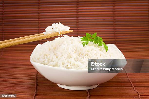 Bowl Of Rice On Mat Stock Photo - Download Image Now - Basmati Rice, Bowl, Breakfast Cereal