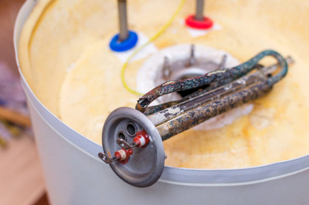 istock Boiler repair, replacement of broken water heating element 1025498720