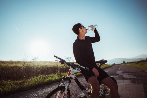 istock Man refreshes after long cycling 1025504230