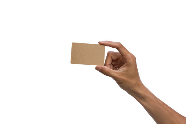 Close-up of a man hand holding brown empty card against white background include clipping path.