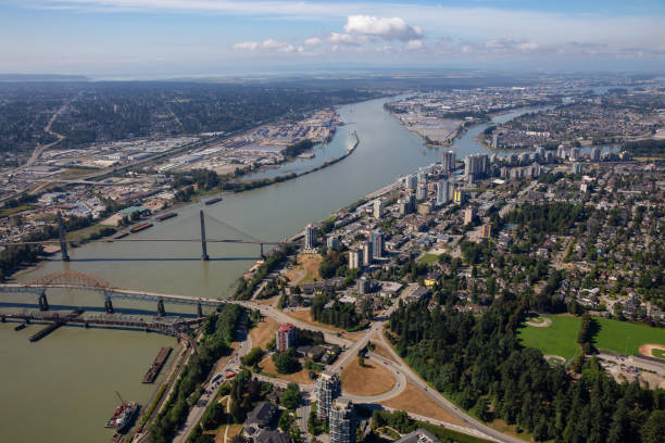 New Westminster Aerial Aerial city view of Pattullo and Skytrain Bridge across the Fraser River. Taken in Greater Vancouver, British Columbia, Canada. new westminster stock pictures, royalty-free photos & images