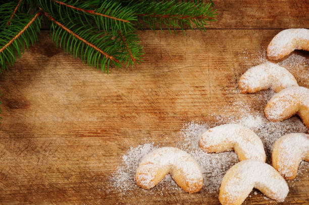 vanilla cones and fir branch isolated over wooden background