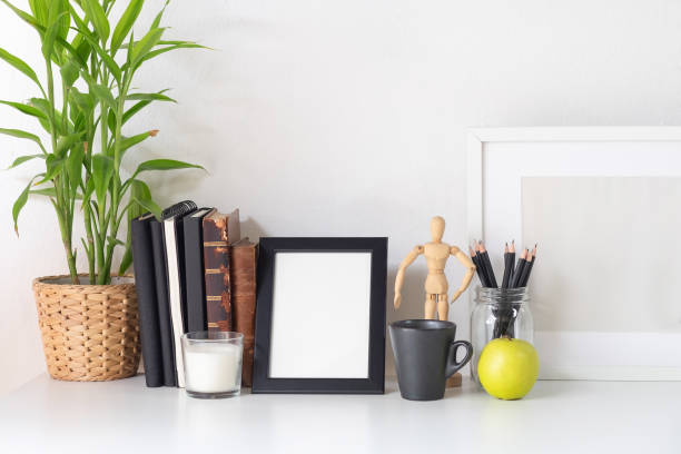 istock Stylish workspace with poster, book and gadget. Workplace desk and copy space. 1025536262