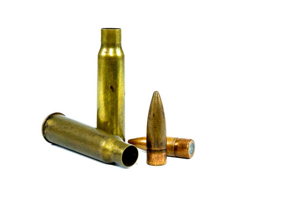 istock The ammunition was used. There is a bullet on the ground. Has a white background 1025536962