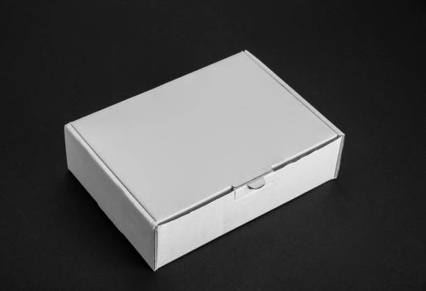 istock Cardboard paper box on a black background 1025539630